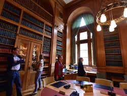 Four people inside Parliament Library