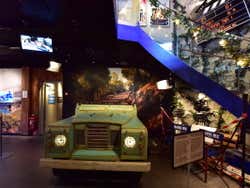 A set of a car with backdrops in the ABBA museum