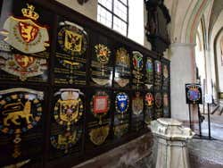 A black display of several crests