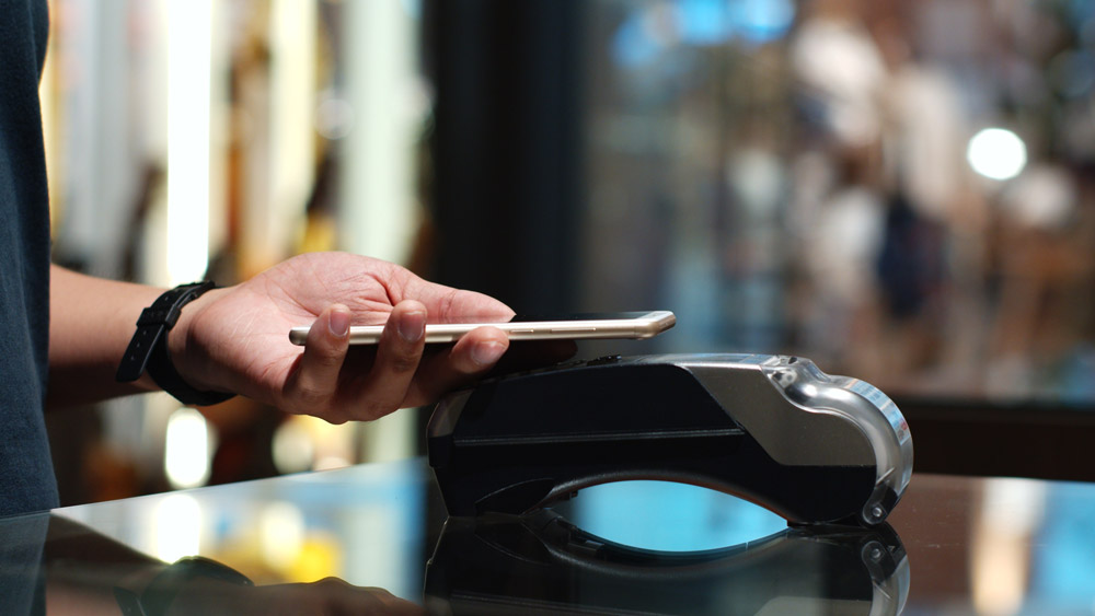 man-using-phone-to-pay