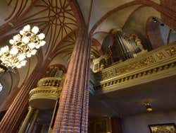 An organ on a balcony in Stockholm Cathedral