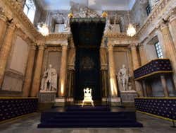 A small throne in the centre of the Hall of State