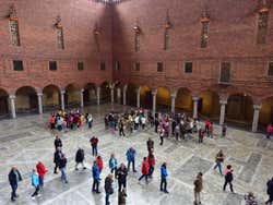 Tourists inside the large Blue Hall